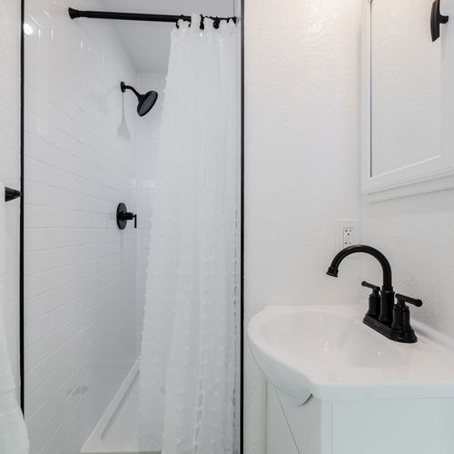 Shower in style with the modern finishes of the fully remodeled en suite bathroom.