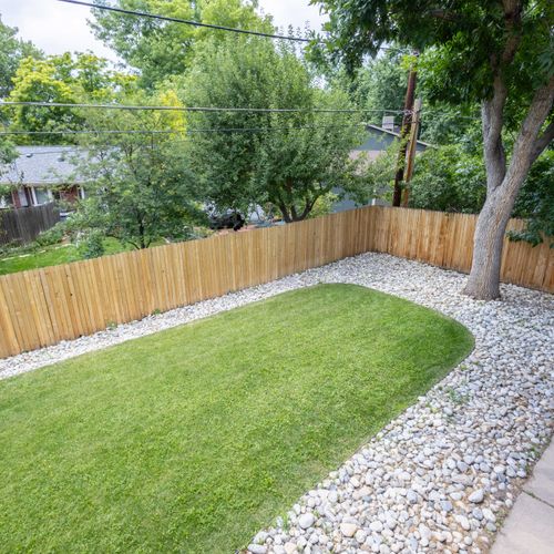 Clean-cut grass and open space make this backyard a true gem.