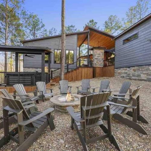 The fire pit complete with Adirondack chairs.