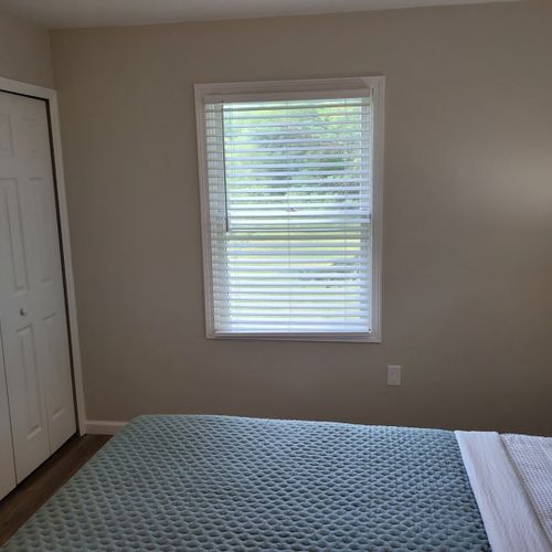 Bedroom #2:  bedroom #2 features a queen-size bed, ceiling fan, dresser, matching nightstands with lamps, and a closet.