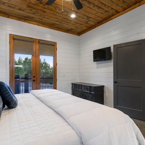 The lower level houses the Master suite with private access to the deck.