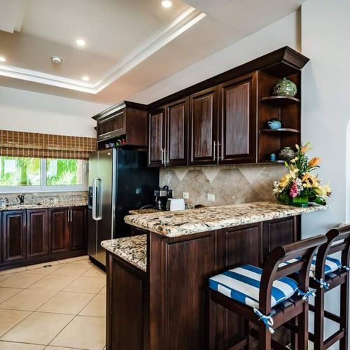 Kitchen is near the living area with a kitchen counter