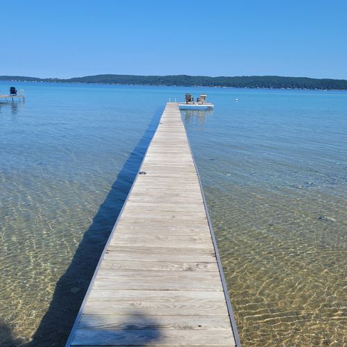 EXTERIOR:  Looking out on the private dock from shore