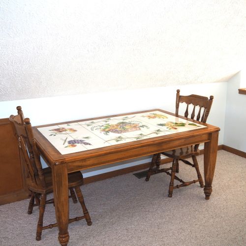 Loft:  there is a large loft area with a full-size bed, dresser, loveseat, chairs, and table.
