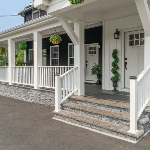 The sprawling front porch makes for a warm and inviting entrance to the home.