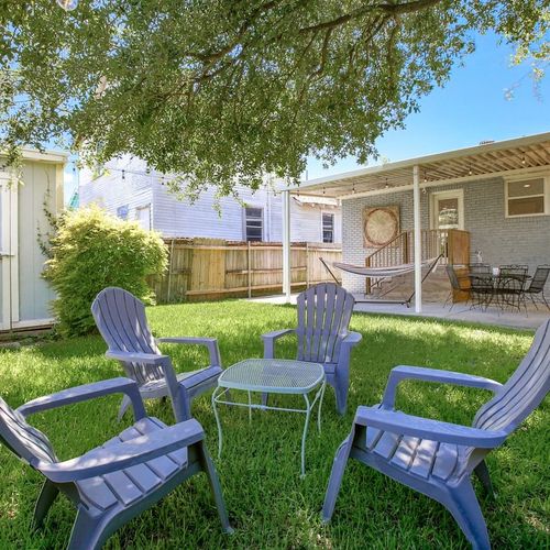 Relax and unwind in this serene backyard oasis. Whether you're enjoying a morning coffee in the shade, lounging in the hammock, or gathering with friends around the fire pit, this space is perfect for making lasting memories in the heart of New Orleans.