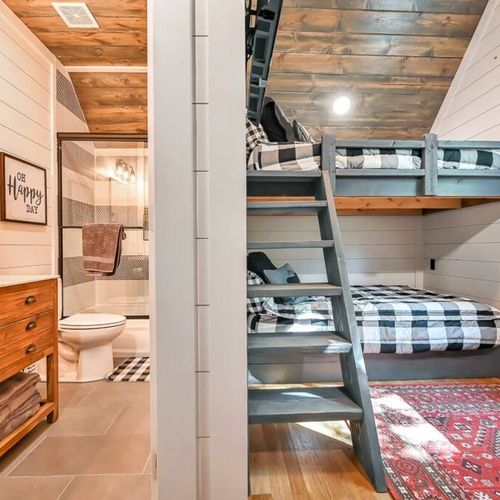 This bunk room also has a private bathroom.