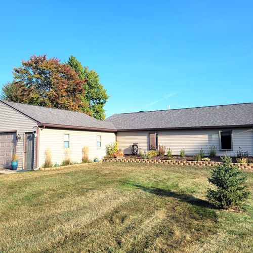 EXTERIOR:  The front of the home, showing the attached garage as well.  (The garage is not available for guest usage.)