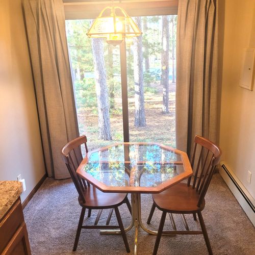 BEDROOM #1 (MAIN FLOOR):  Huge primary bedroom on the main floor with private ensuite bathroom and its own television, kitchenette, and dining table!