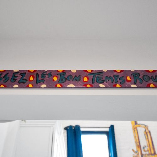 Glowing Mardi Gras bead arrangement adds a festive, one-of-a-kind local touch.