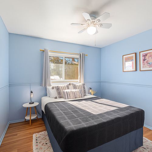 Find your tranquil reading spot here. Snuggle up in fresh linens and plush pillows on this comfortable queen bed in the upstairs bedroom.