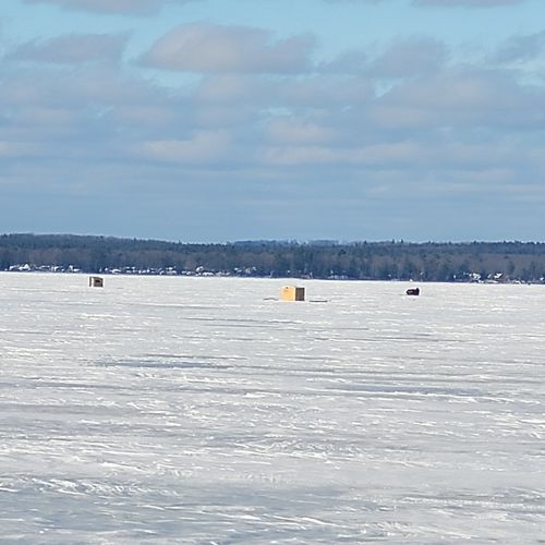 Exterior:  ice fishing at higgins lake. The lake is quite popular for ice fishing.