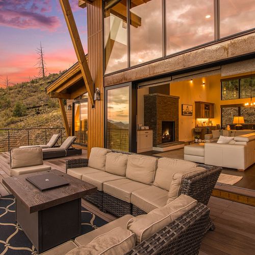 - fire table glows as the sunset paints the skies beyond your private retreat
- lounge inside or out with accordion doors that blend comfort and nature
- this is your dream setting for evening wine, laughter, and lasting memories