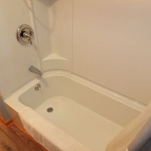 Bathroom #1:  full bathroom with a combination tub and shower.
