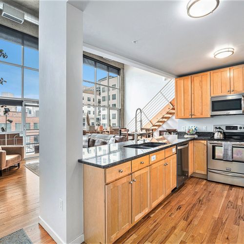 Bring out the chef in you in this spacious, open-concept kitchen with granite countertops and stainless steel appliances — perfect for creativity and connection!