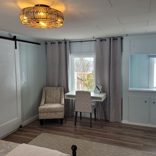 Bedroom #1:  bedroom #1 is the primary bedroom. It features a queen-size bed, ceiling fan, live streaming television, nightstands, lamps, a closet, a large dresser, a desk, and a comfy chair. There is also a door from the bedroom to the garage. (the door is fully lockable. )