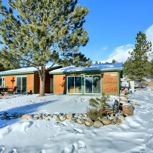 This cabin is convenient situated near the front yard space and driveway.