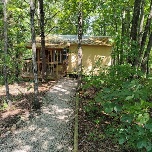 Exterior:  the front of the cabin in the summer. Note that "hillbilly-chic" design. ;-)