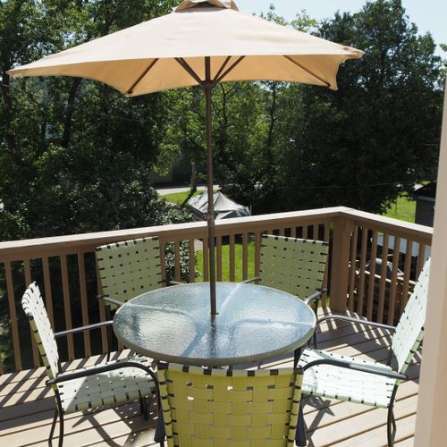 Overall:  the private second floor deck and dining furniture