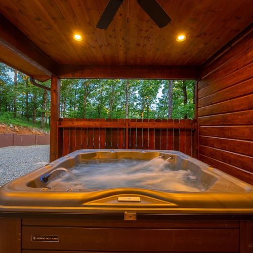 A luxury oversized hot tub on the covered patio.