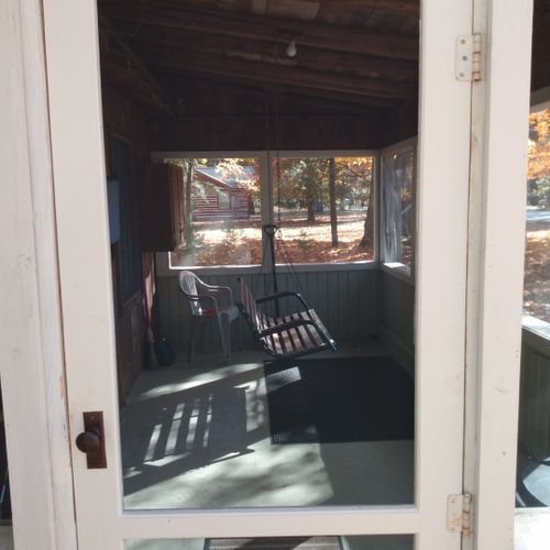 Front porch: the private screened-in front porch.