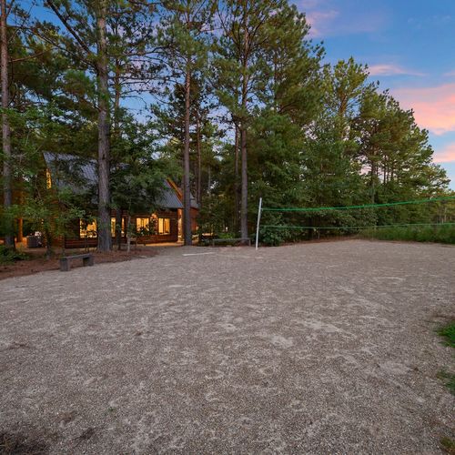 Volleyball court in the back of the property!