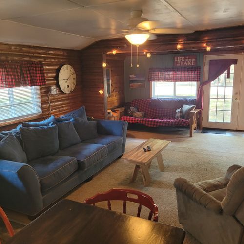 Living room:  large and comfy living room with a sofa, comfy chair, coffee table, and streaming television.