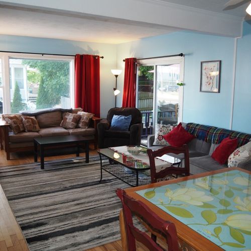 Living room:  comfy and cozy living room with sofa, comfy chair, futon, 2 coffee tables, and a large live streaming television that uses the cottage's high-speed cable wi-fi.