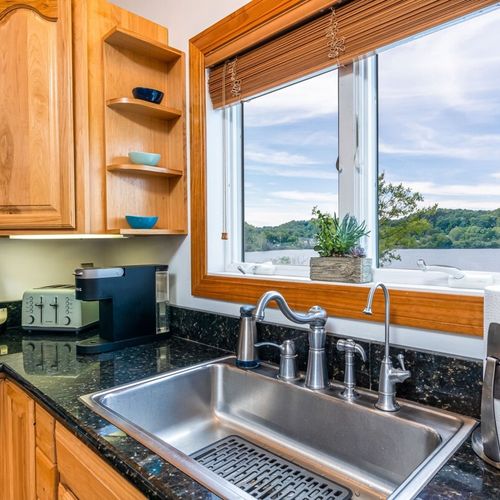 Kitchen:  the home has a large modern kitchen with all appliances, a large kitchen island with seating, and great views of betsie lake!
