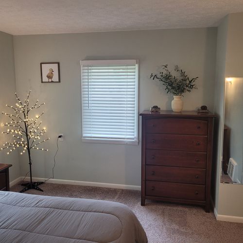 BEDROOM #1:   Master bedroom with a queen-size bed, walk-in closet, private en suite full bathroom, and streaming television.