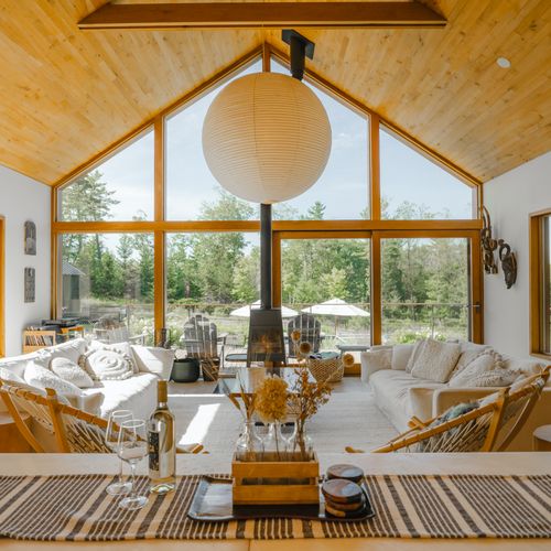 the open concept kitchen and beautiful main living room that looks out over the deck