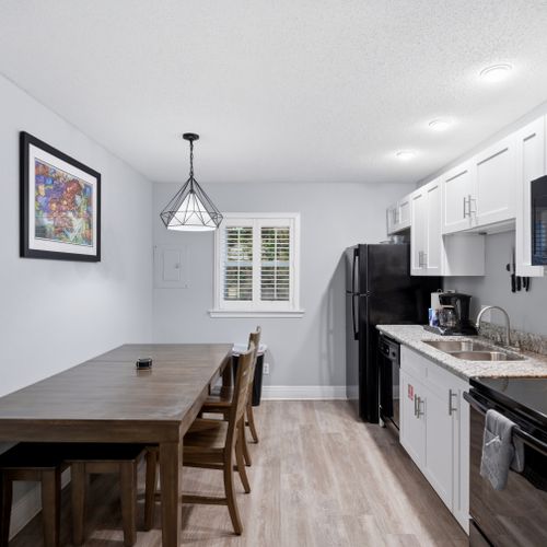 Dining space tucked beside the kitchen for easy casual meals.