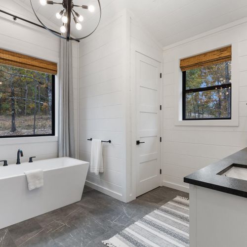 The private bath includes a walk-in shower and oversized soaking tub!