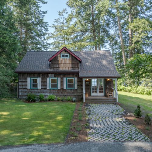 With a new roof, windows and a few new shakes, you can enjoy a historic cottage with the warmth of a new home.