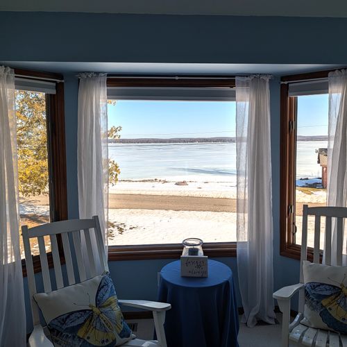 BEDROOM #2 (SECOND FLOOR):  The home has a huge primary bedroom on the second floor with a queen-size bed, private ensuite bathroom, and great views of Big Platte Lake!