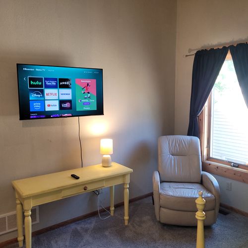 BEDROOM #4 (SECOND FLOOR):  Features 2 twin beds, a closet, a chair, and private live-streaming television.