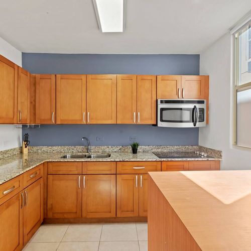 A charming and functional kitchen. The warm wooden cabinets and spacious counters provide everything you need to prepare meals with ease.