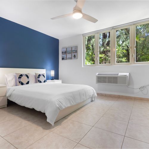 Drift into a peaceful night's sleep in our serene bedroom, designed for ultimate relaxation. Sink into the comfortable queen-size bed after a day of sun and exploration.