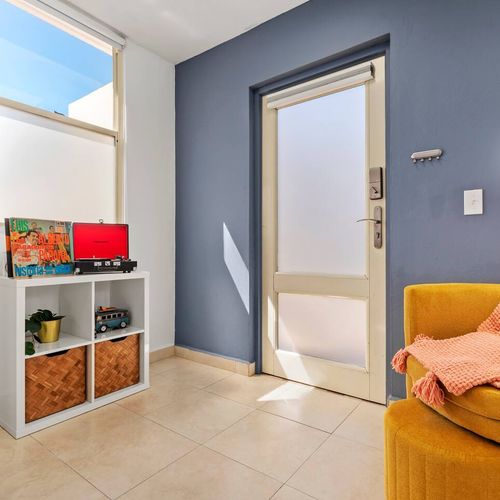 A cozy and well-appointed space. The living room features a large TV and a chic design, making it a great place to relax after a day of adventure.