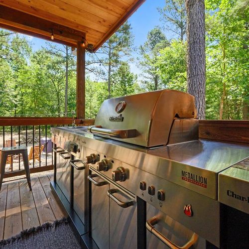 The gas grill on the covered patio!