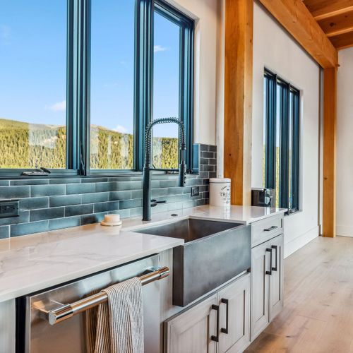 Your dream kitchen awaits, framed by stunning mountain scenery and clean design.