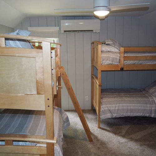 Bedroom #7 (second floor):  has two twin-on-twin bunk beds plus a separate twin bed, thus sleeping 5 people.