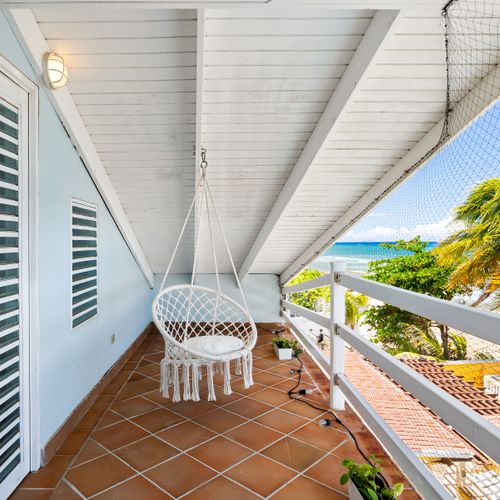 beachfront balcony with hammock