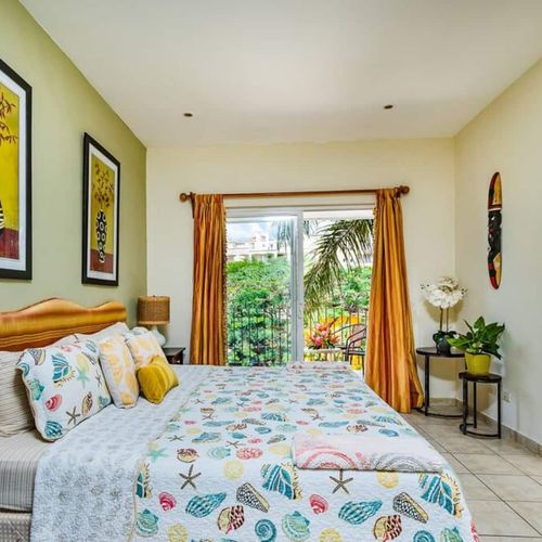The master bedroom has a private balcony and the en-suite bathroom comes with a detachable shower head.