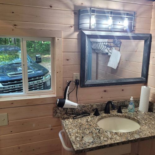 Bathroom:  very cute full bathroom with sink, vanity, mirror, shower, and toilet