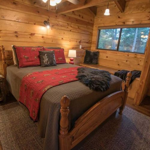 Upstairs you will find 1/4 bedrooms. Equipped with a Queen Bed.