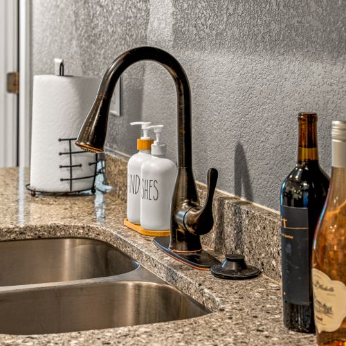 A sleek and tidy sink space that keeps things functional while looking effortlessly stylish.