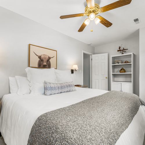Rest easy in this beautifully designed bedroom with soft, cozy bedding.