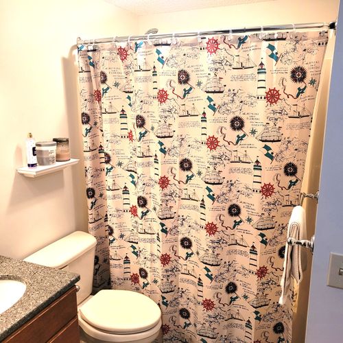 BATHROOM #2:  Full common bathroom that also has a washer and dryer in it.