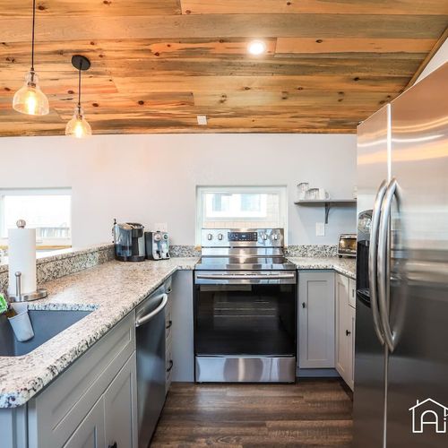 The space has been renovated with stainless steel appliances.